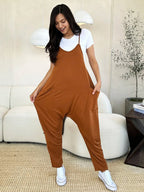 Women's sleeveless V-neck wide-leg jumpsuit with pockets, stylish and comfortable, from Trendsi.