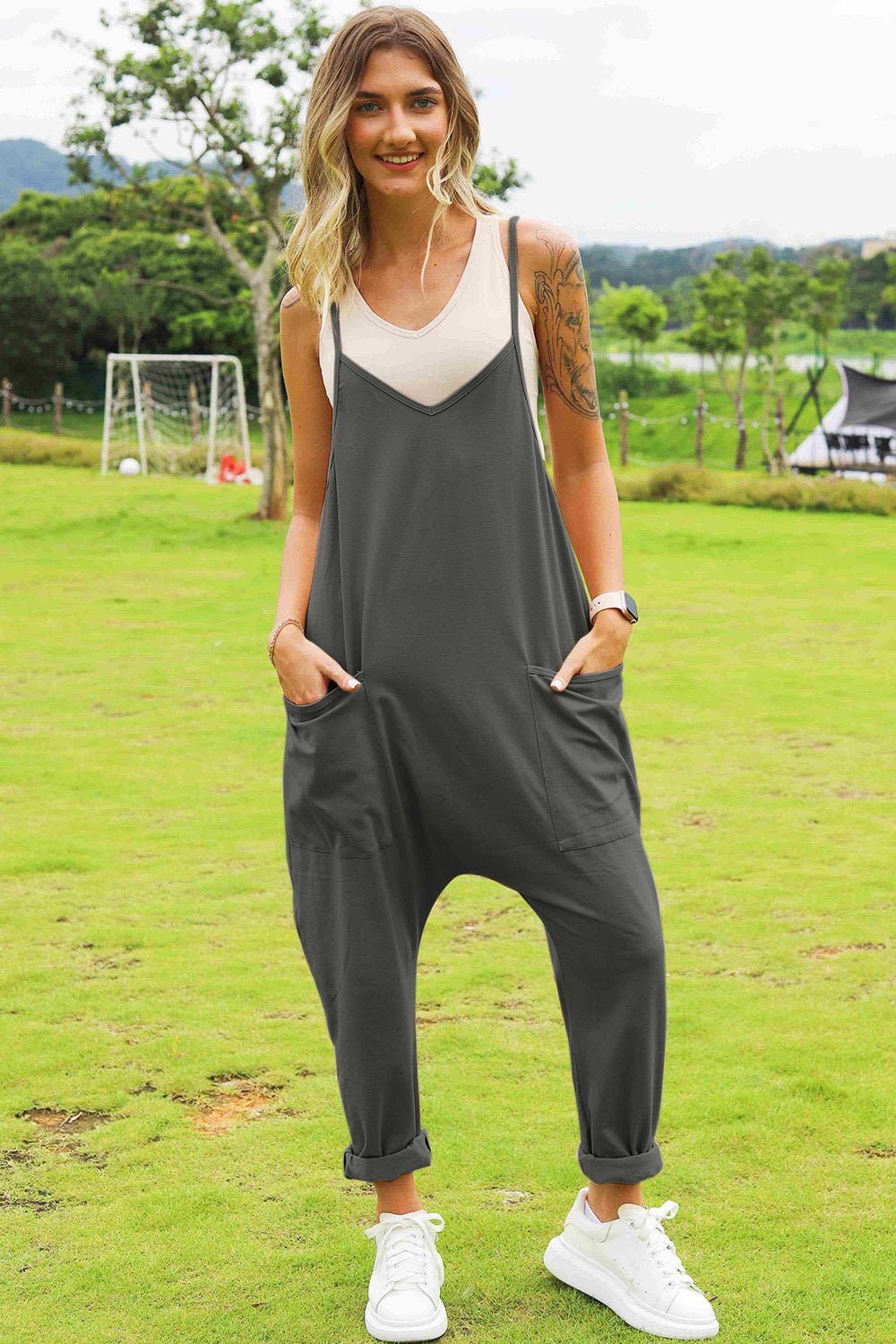 Women's sleeveless V-neck wide-leg jumpsuit with pockets, stylish and comfortable women’s fashion by Trendsi.