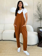 Women’s sleeveless V-neck wide-leg jumpsuit with pockets, trendy and comfortable fashion by Trendsi, shown in full length.