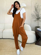 Women's sleeveless V-neck wide-leg jumpsuit with pockets, stylish and comfortable, from Trendsi.