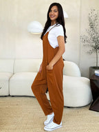 Women's sleeveless V-neck jumpsuit with wide legs and pockets, stylish and comfortable women's apparel by Trendsi.