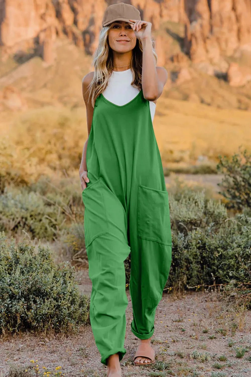 Women's sleeveless V-neck jumpsuit with pockets, lightweight casual romper by Plush Fashion Hub, full-length, comfortable summer outfit.