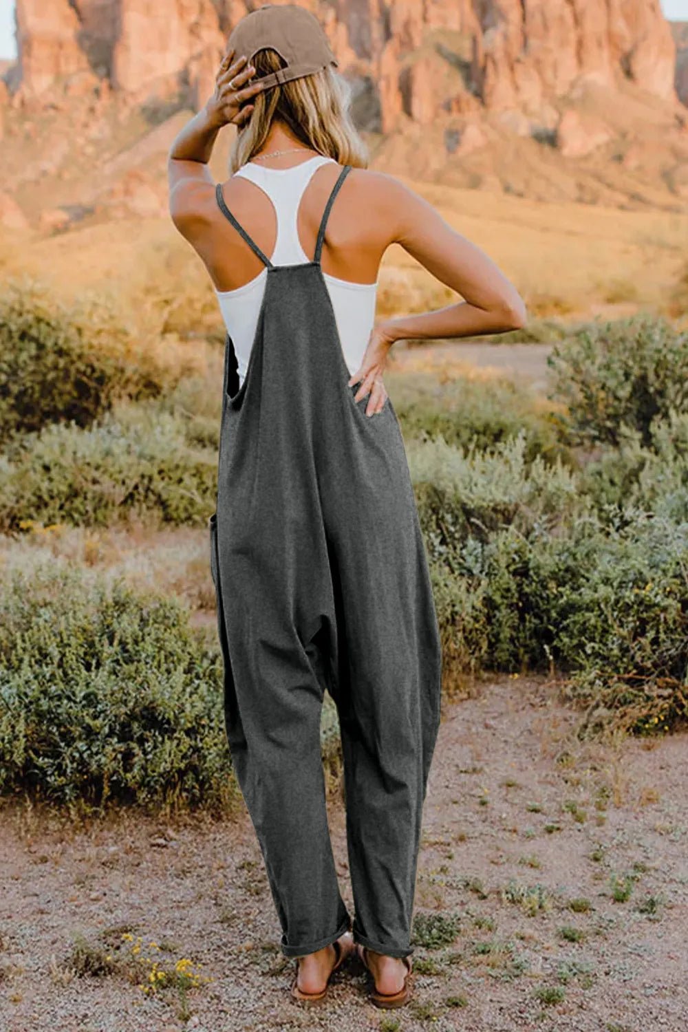 Women's sleeveless V-neck jumpsuit with pockets, lightweight and casual, by Plush Fashion Hub, perfect for warm weather.