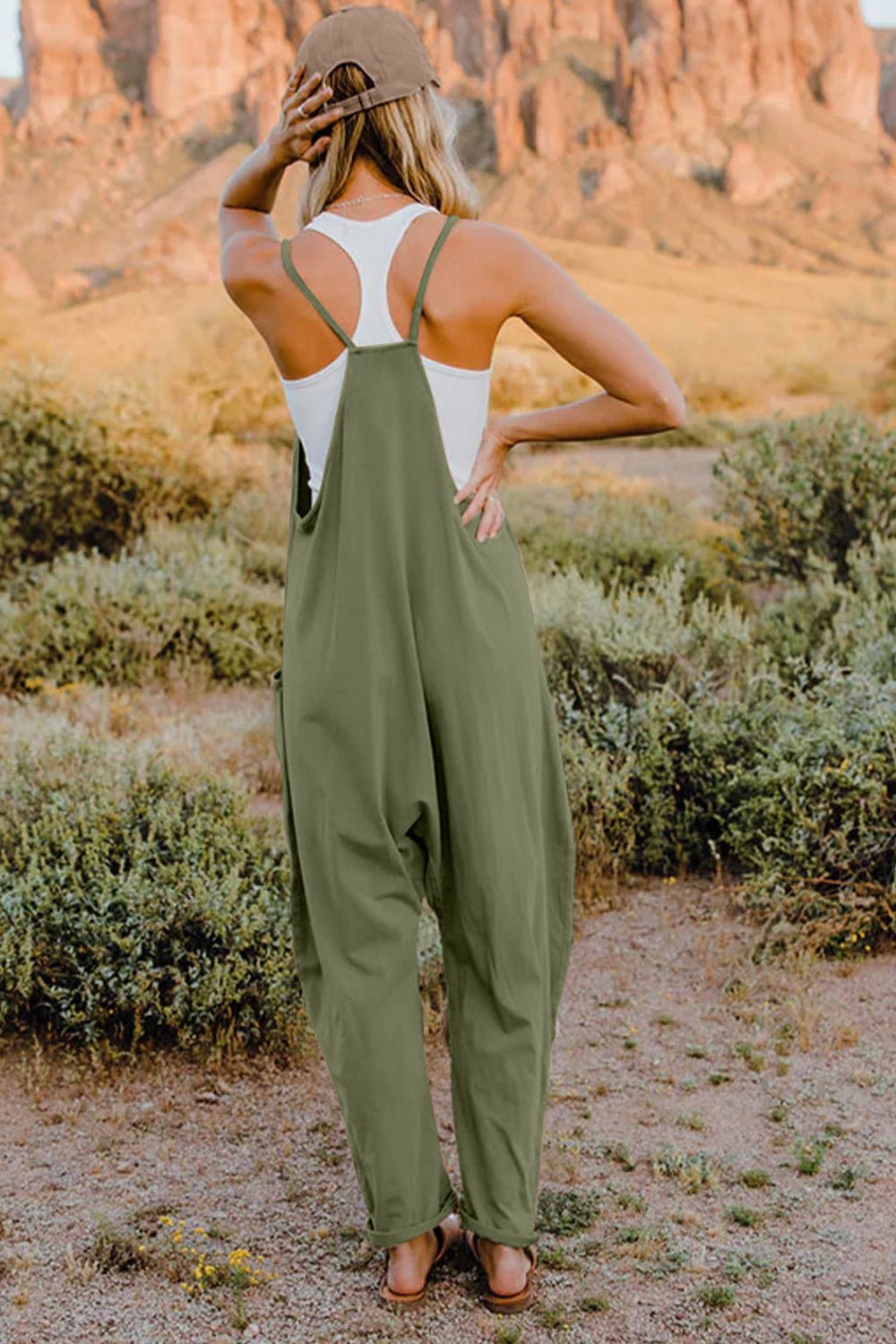 Women’s sleeveless V-neck jumpsuit with pockets, lightweight casual romper from Plush Fashion Hub, perfect for warm-weather wear.