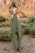 Women’s sleeveless V-neck jumpsuit with pockets, lightweight casual romper from Plush Fashion Hub, perfect for warm-weather wear.
