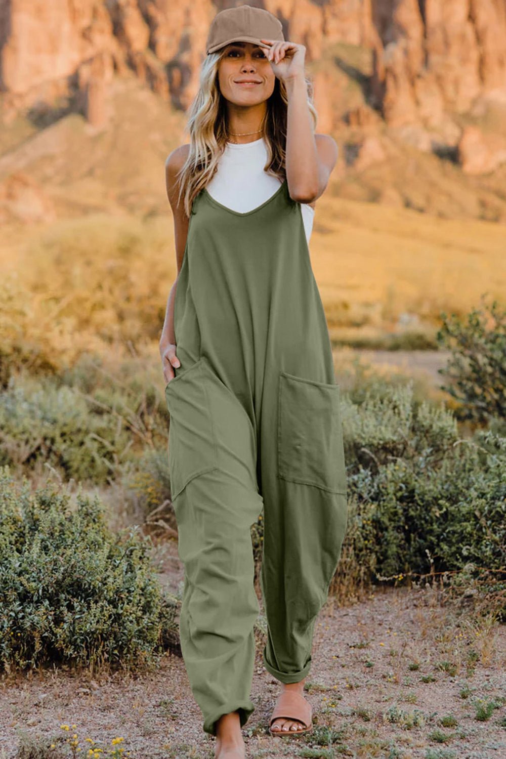 Lightweight women's V-neck sleeveless jumpsuit with pockets by Plush Fashion Hub, casual romper perfect for warm weather.