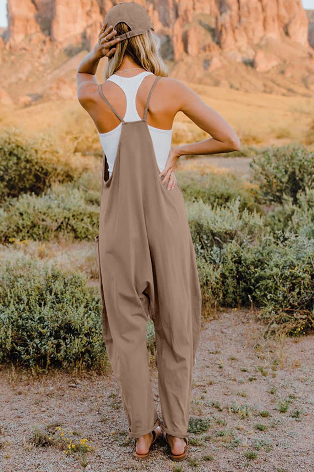 Women’s sleeveless V-neck jumpsuit with pockets, lightweight casual romper from Plush Fashion Hub, perfect for warm-weather wear.
