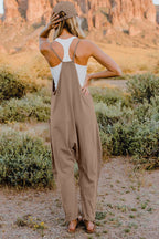 Women’s sleeveless V-neck jumpsuit with pockets, lightweight casual romper from Plush Fashion Hub, perfect for warm-weather wear.