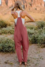 Women’s lightweight V-neck sleeveless jumpsuit with pockets, casual romper by Plush Fashion Hub, full-length front view.