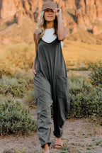Women's sleeveless V-neck jumpsuit with pockets, lightweight casual romper from Plush Fashion Hub, perfect for warm weather.