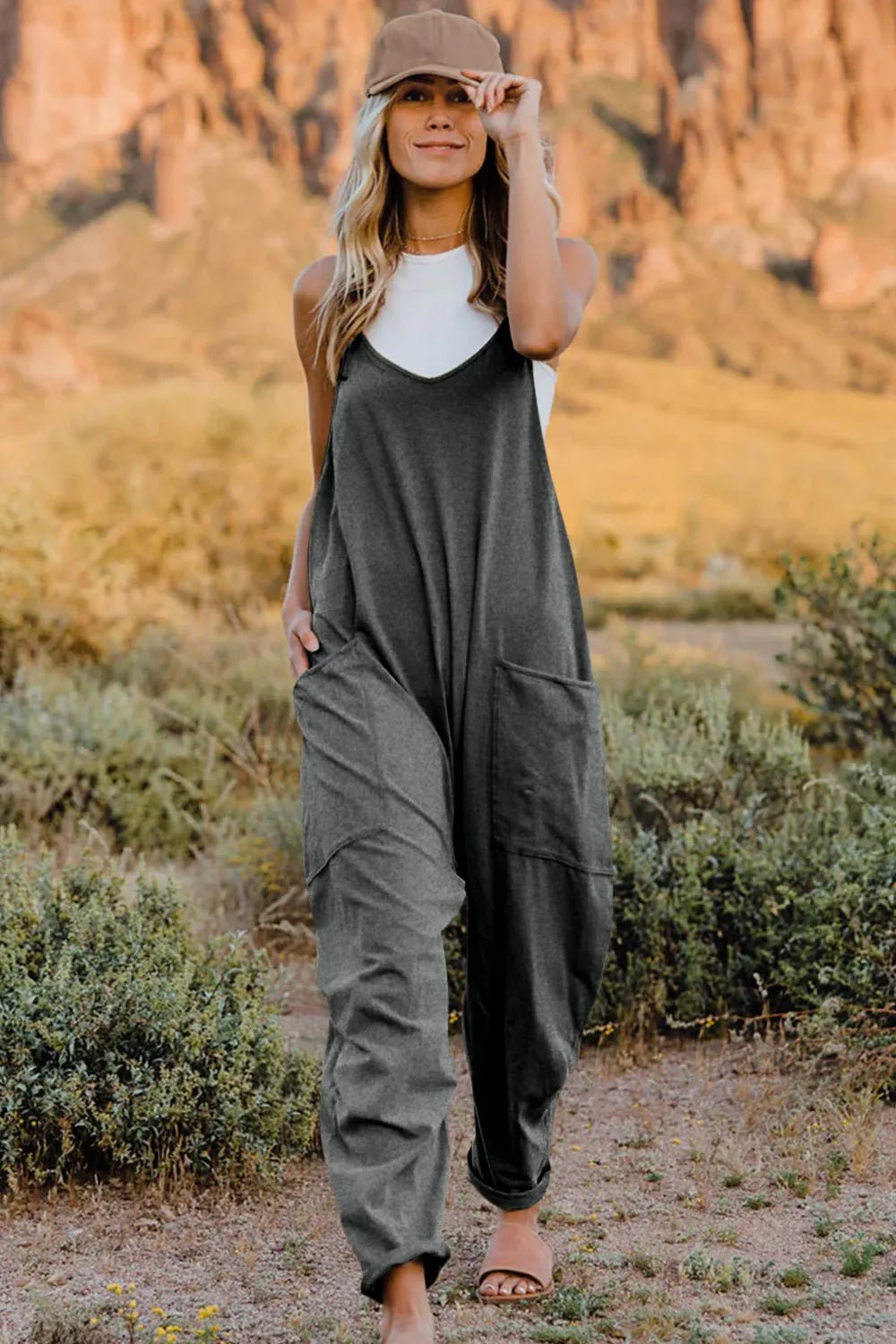 Women's sleeveless V-neck jumpsuit with pockets, lightweight casual romper from Plush Fashion Hub, perfect for warm weather.