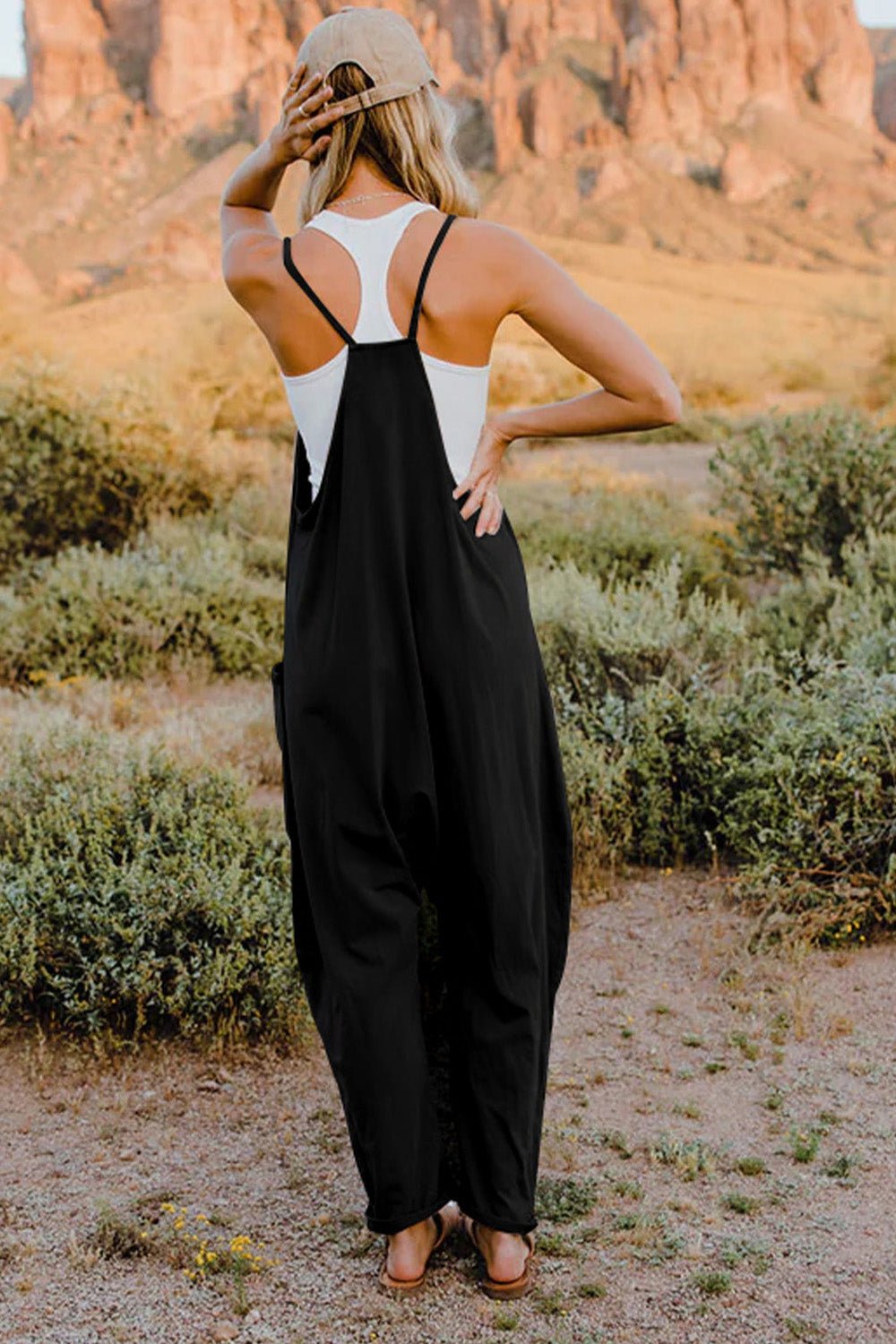 Women's sleeveless V-neck jumpsuit with pockets, lightweight casual romper by Plush Fashion Hub, perfect for comfortable everyday wear.