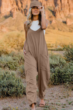 Women’s V-neck sleeveless jumpsuit with pockets, lightweight casual romper by Plush Fashion Hub, perfect for warm-weather wear.