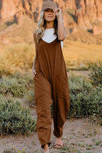 Women’s V-neck sleeveless jumpsuit with pockets, lightweight casual romper by Plush Fashion Hub, shown full-length on a model.