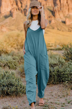 Women’s lightweight V-neck sleeveless jumpsuit with pockets, casual romper by Plush Fashion Hub, full-length front view.