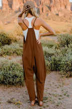 Women’s V-neck sleeveless jumpsuit with pockets, lightweight casual romper by Plush Fashion Hub, shown in full length.