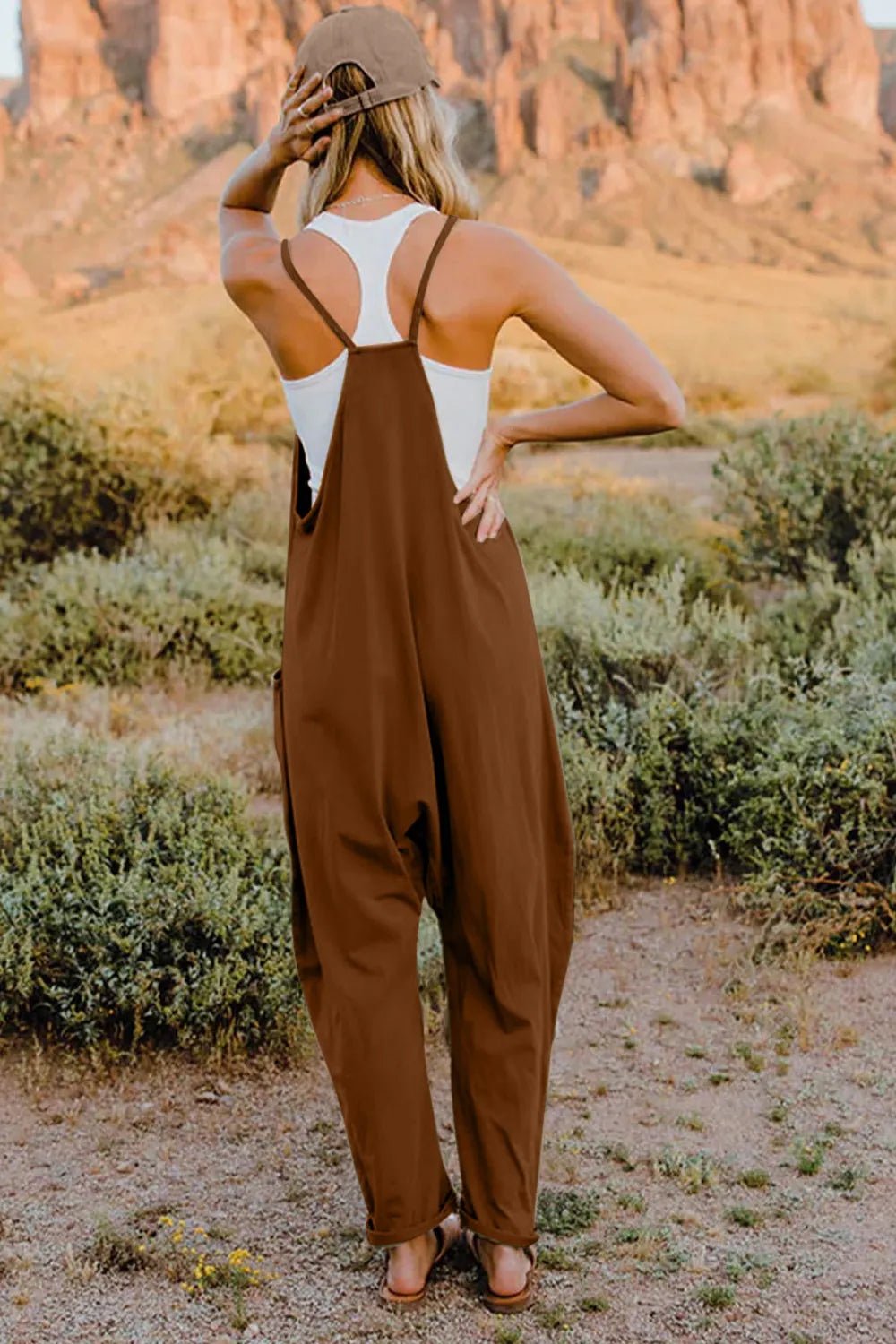 Women’s V-neck sleeveless jumpsuit with pockets, lightweight casual romper by Plush Fashion Hub, shown in full length.