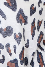 Women's leopard print long sleeve knit cardigan by Trendsi, soft layered sweater with stylish animal print design.