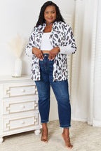Women's leopard print long sleeve knit cardigan by Trendsi, soft layered piece featuring a stylish animal print design.