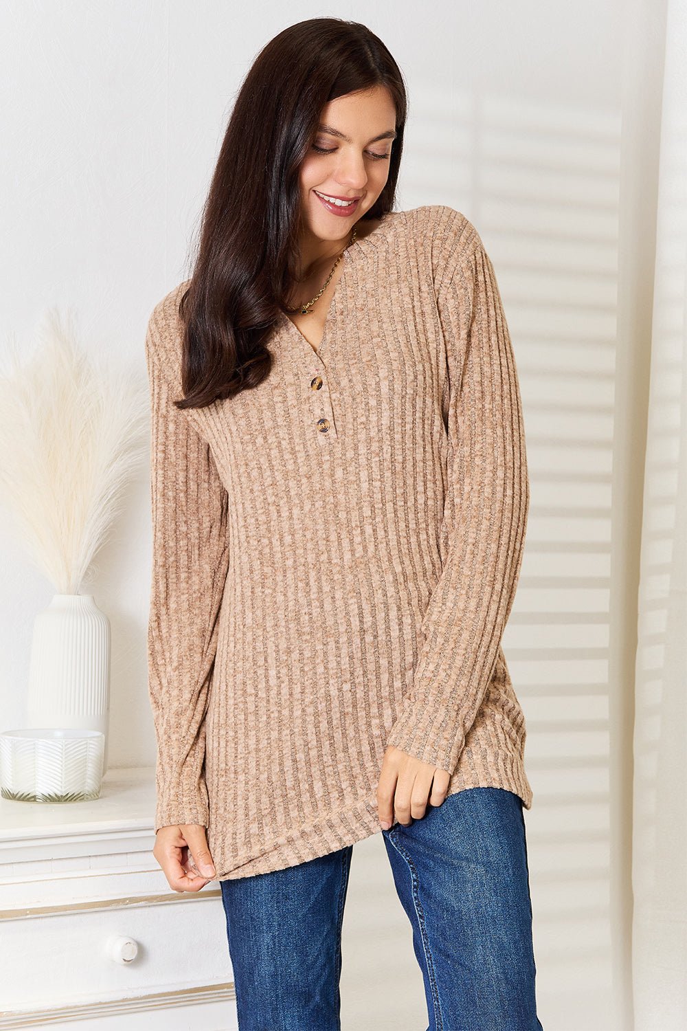 Women’s ribbed long sleeve notched neck t-shirt by Trendsi, slim fit casual top with a stylish notched neckline and textured ribbed fabric.