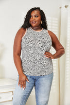 Women's printed sleeveless tank top with round neckline, lightweight summer essential from Trendsi, featuring vibrant print design.