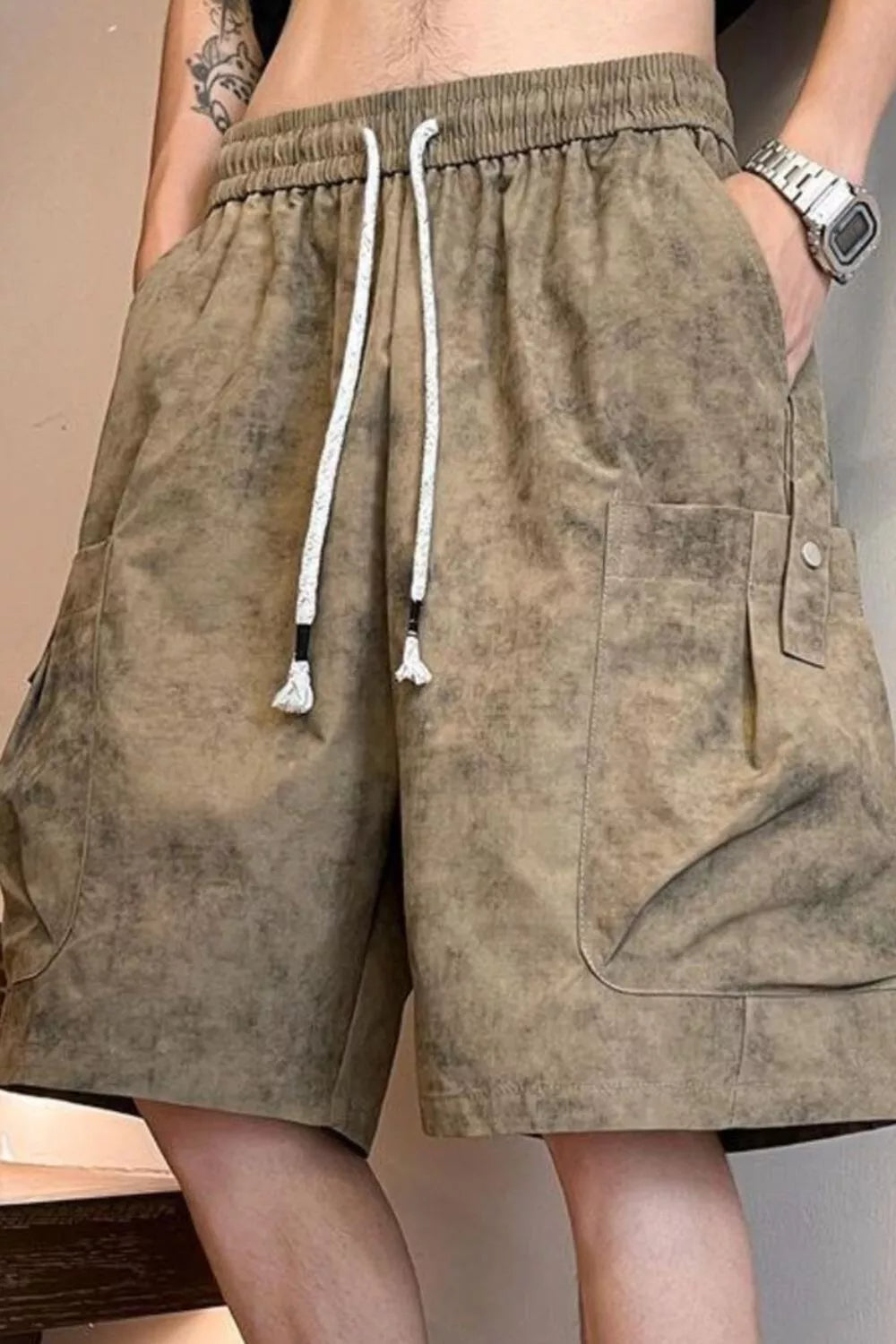 Men's plus size drawstring shorts with pockets, featuring a rings design, from Trendsi, shown in this image.