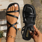 Shopimist crisscross strappy flat sandals with open toes and ankle straps, showcasing a stylish and comfortable footwear design.