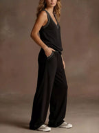 Plus size V-neck tank top and wide-leg pants set by Trendsi, featuring a comfortable fit and stylish design in a full size.