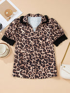 Leopard print short sleeve blouse with lace trim and button front, stylish top by Plush Fashion Hub.