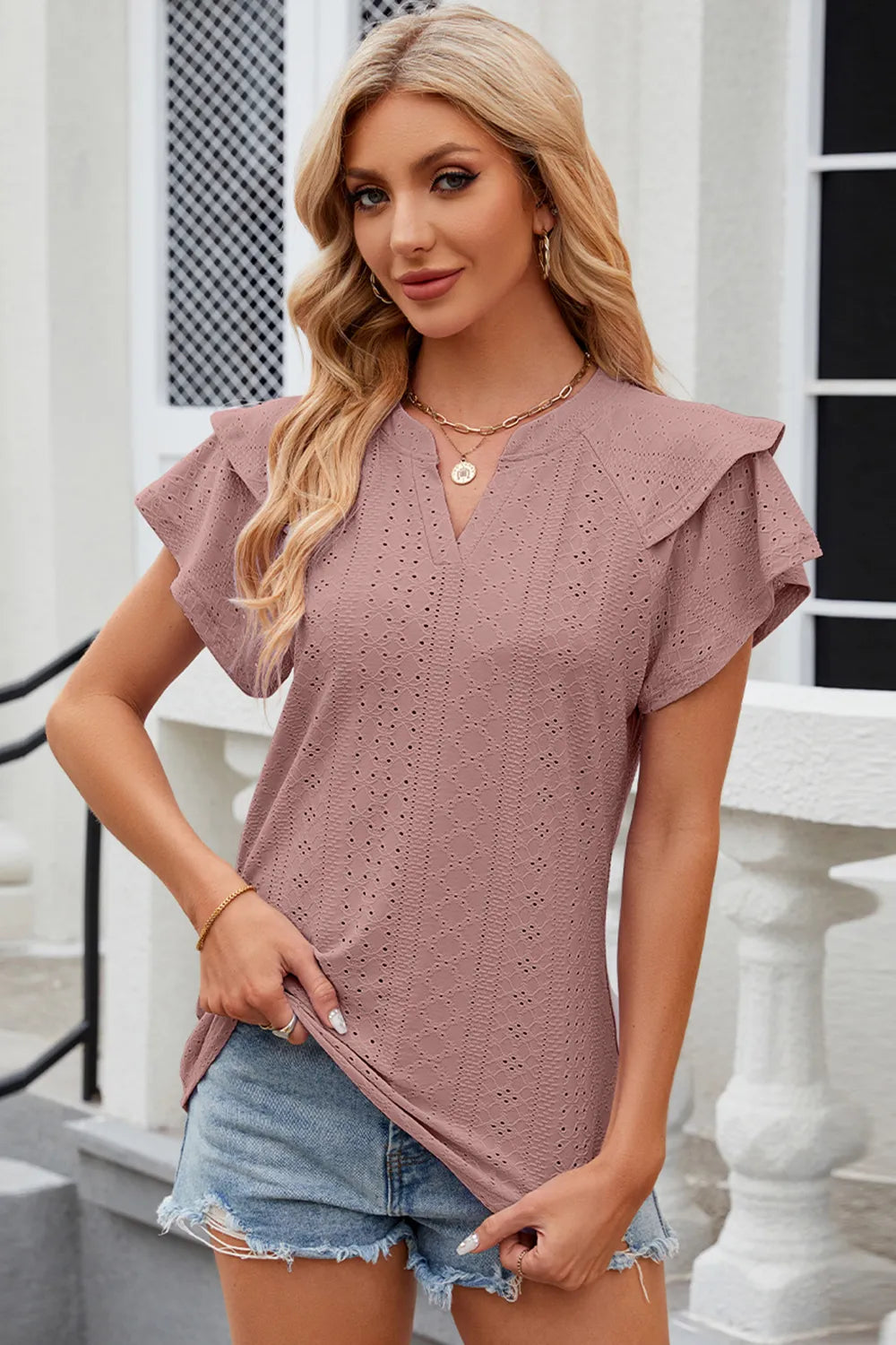Light blue eyelet notched flutter sleeve t-shirt from Trendsi, showcasing detailed flutter sleeves and eyelet accents.