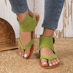 Women's faux leather ankle strap flat sandals by Trendsi, featuring comfortable design and stylish open-toe silhouette.