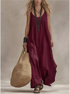 Plus size full-length scoop neck sleeveless maxi dress by Shopimist, flowing fabric and elegant design in natural setting.