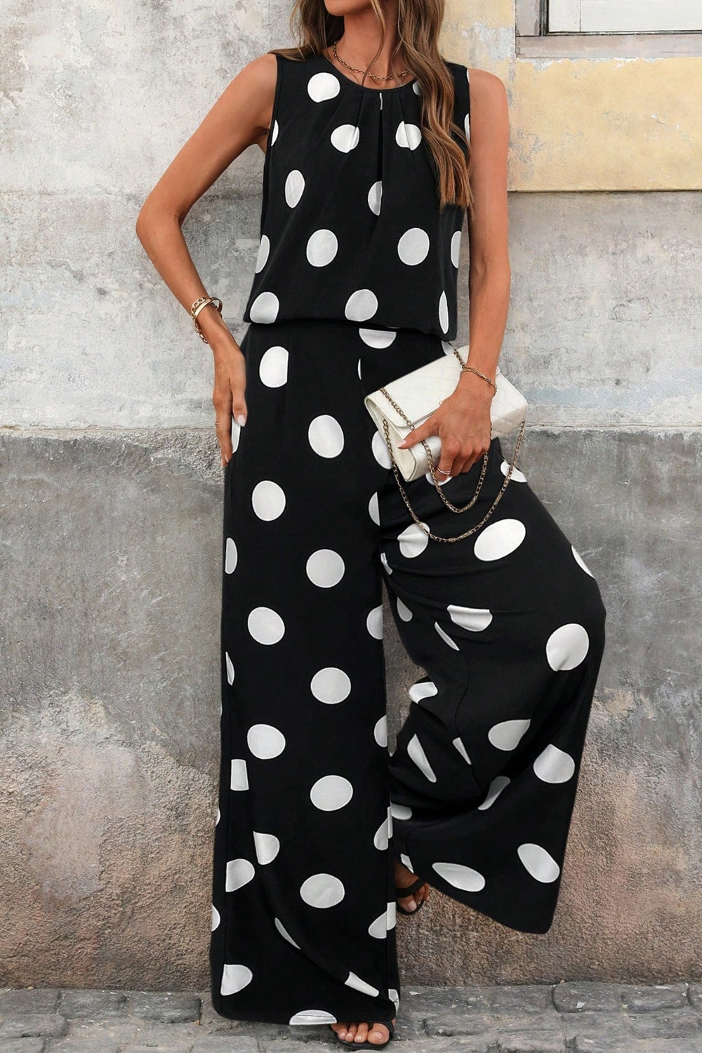 Polka dot sleeveless top and wide-leg pants two-piece set by Trendsi, featuring a stylish matching polka dot design and casual fit.