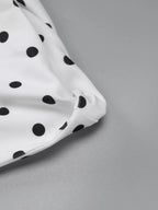 Polka dot sleeveless mini dress with bow accents by Shopimist, featuring a fitted silhouette and playful pattern.