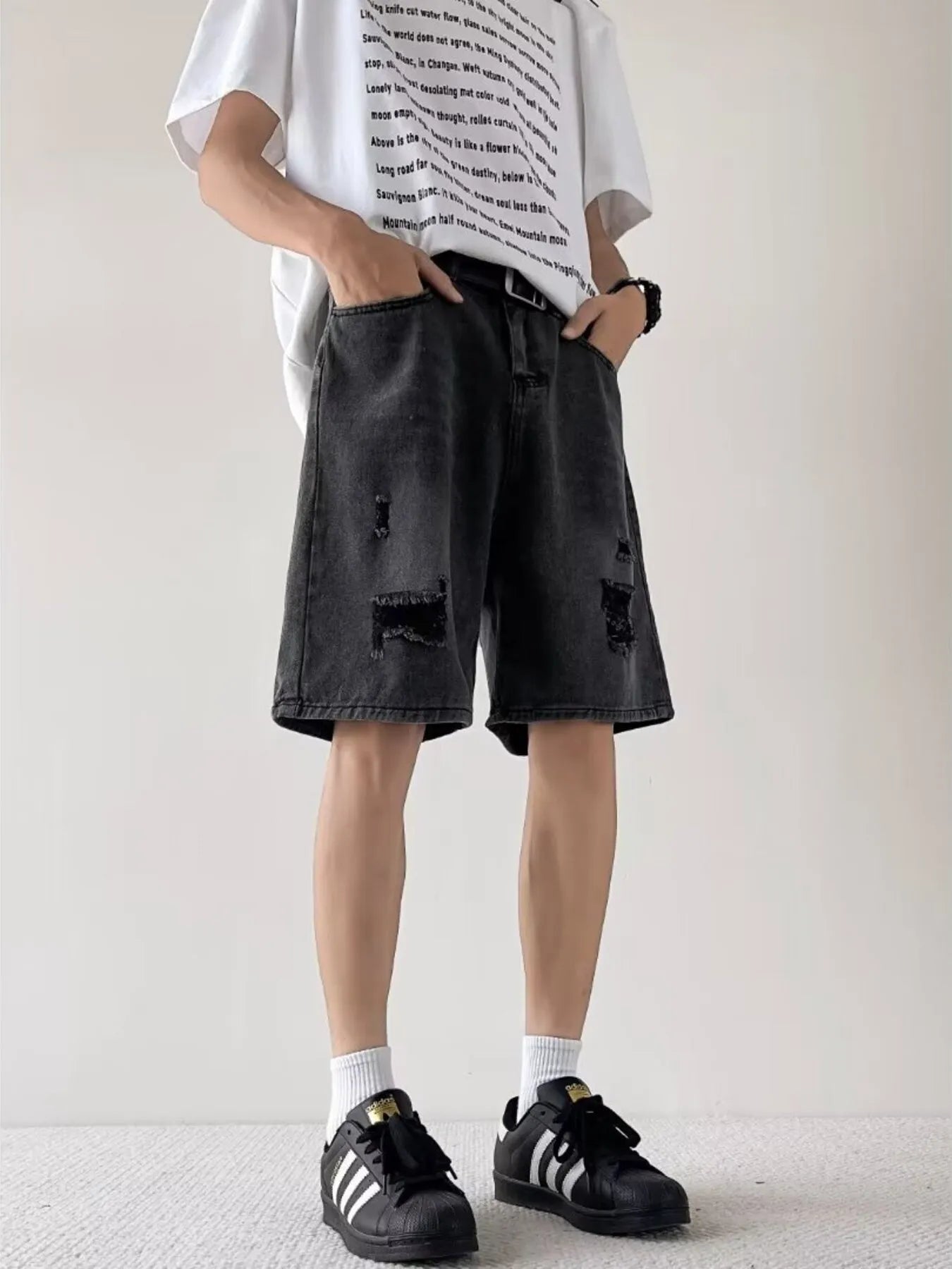 Men's casual loose fit ripped denim shorts in plus size by Simply Love, showing distressed denim and relaxed style.