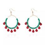 Christmas beaded hoop earrings with jingle bells, featuring festive red and green beads and silver hoops, by Shopimist.