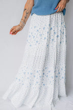 Women's high waisted floral boho maxi skirt with a flowy tiered design in lightweight viscose fabric.