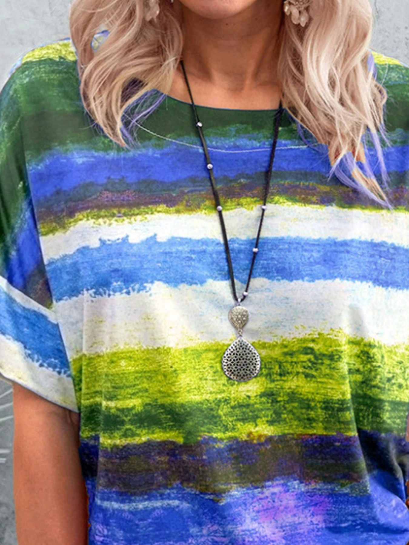 Women's casual T-shirt by Trendsi featuring a contrast round neck and short sleeves, displayed on a neutral background.
