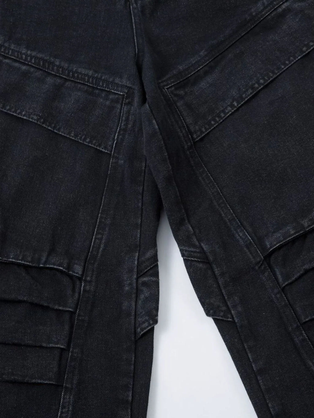 Men's wide leg denim jeans from Plush Fashion Shop, showing the relaxed fit and classic blue denim fabric.