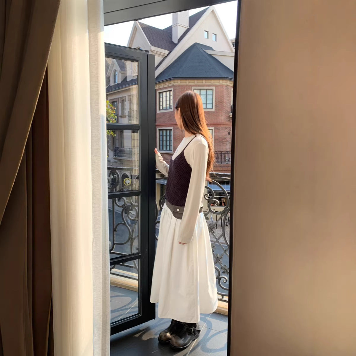 FitiqueFit relaxed A-line cotton midi skirt with crushed pleats and belt, casualwear style, shown on a model.