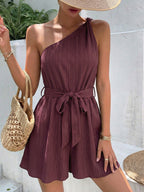 Elegant one-shoulder tie-waist romper in premium polyester, stylish summer jumpsuit by Plush Fashion Hub, shown on model.