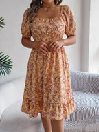 Floral puff sleeve dress with ruffled hem by Shopimist, featuring a feminine design and lightweight fabric perfect for spring and summer.
