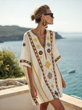 Women's printed loose A-line beach midi dress by FitiqueFit, featuring a flowy design and vibrant vacation resort-inspired pattern.