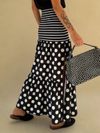 Flowy women's polka dot and striped slit maxi skirt by Trendsi, featuring a casual bohemian style with a relaxed fit and lightweight fabric.