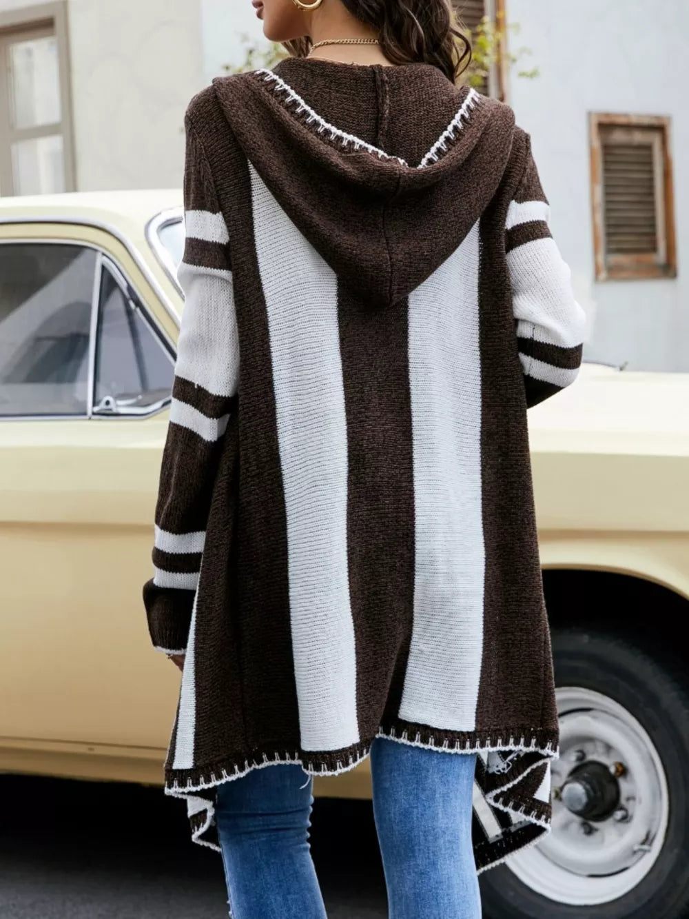 Striped hooded open front cardigan from Plush Fashion Hub, featuring soft fabric and casual style with front pockets.