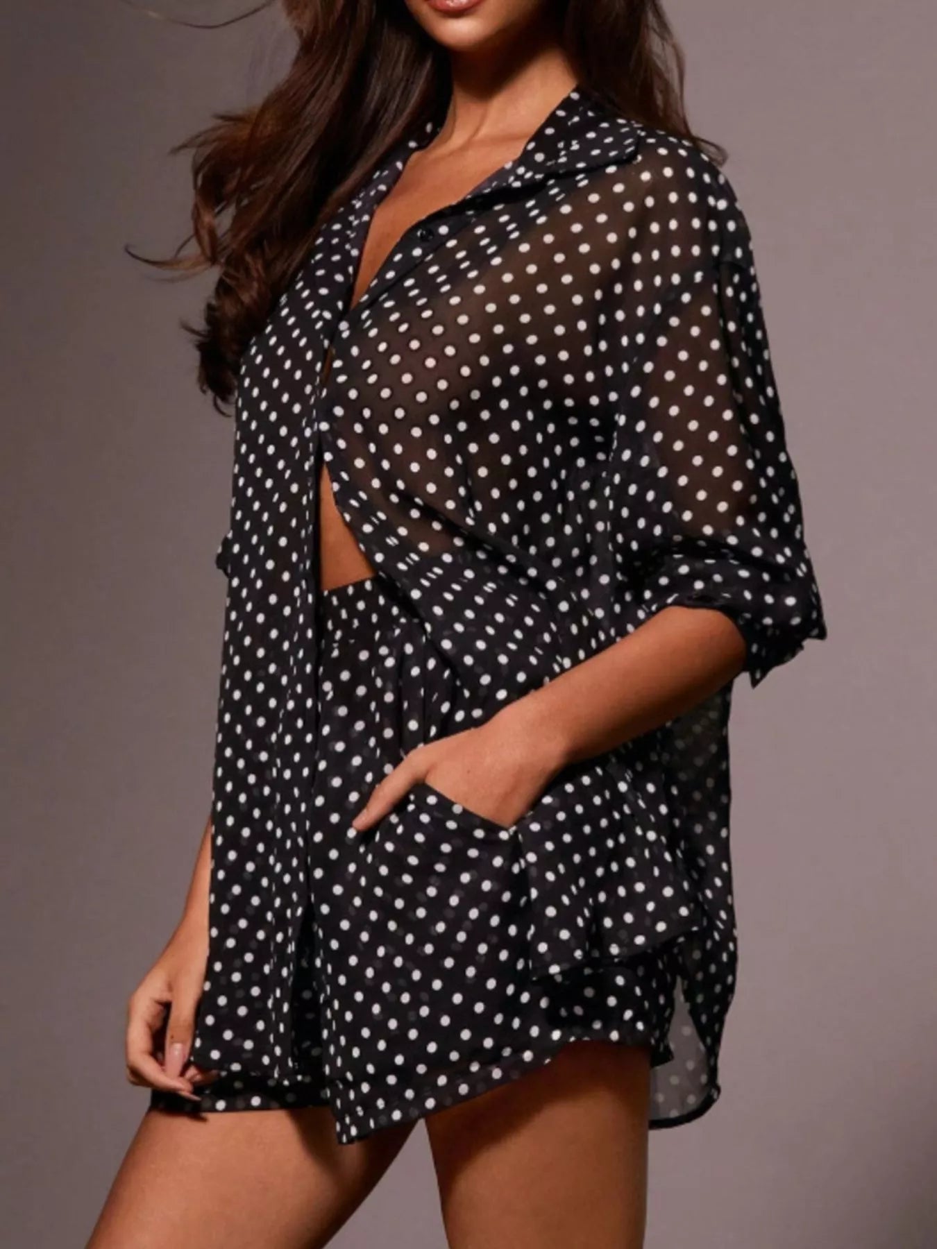 Polka dot button-up shirt and shorts set by Plush Fashion Hub, featuring a playful polka dot pattern and casual summer style.