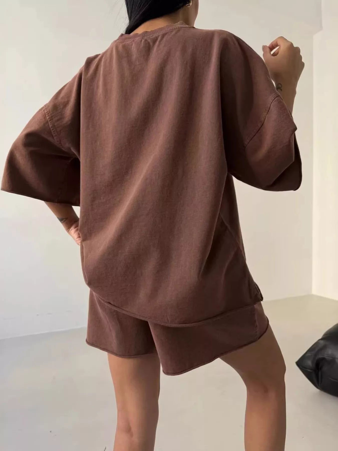 Vintage wash oversized lounge set featuring a relaxed T-shirt and matching shorts from Trendsi, perfect for casual wear.