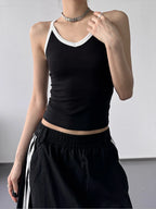 Contrast trim cami top from Trendsi featuring a sleek, fitted design with contrasting trim details, perfect for casual or layered looks.
