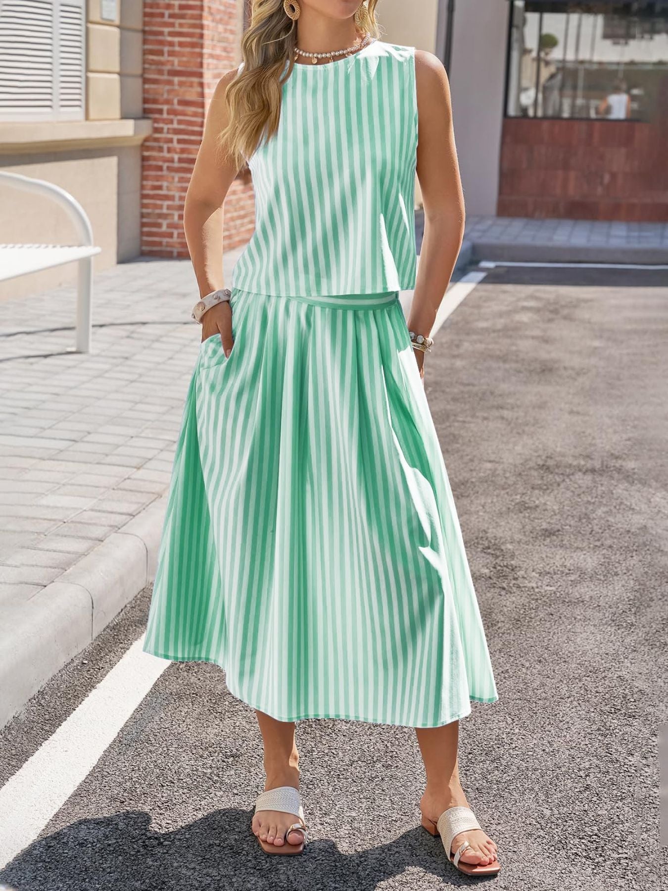 Women's striped sleeveless top and midi skirt two-piece set by Trendsi, featuring a stylish matching striped design.