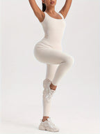 Women’s FitiqueFit ribbed sleeveless jumpsuit, activewear with a fitted ribbed design, shown on a model.